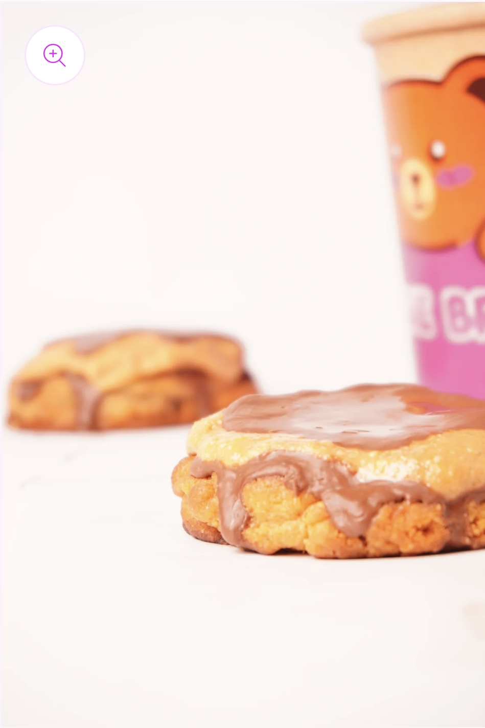 Side view of Peanut Buttercup Cookie showing its layered brown butter and chocolate top