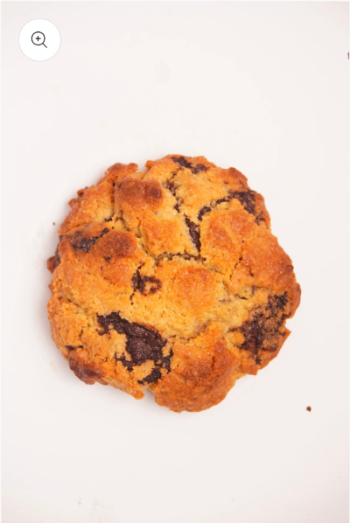 Side view of Giant 3.5 Oz American Cookie showing its thick, chunky texture