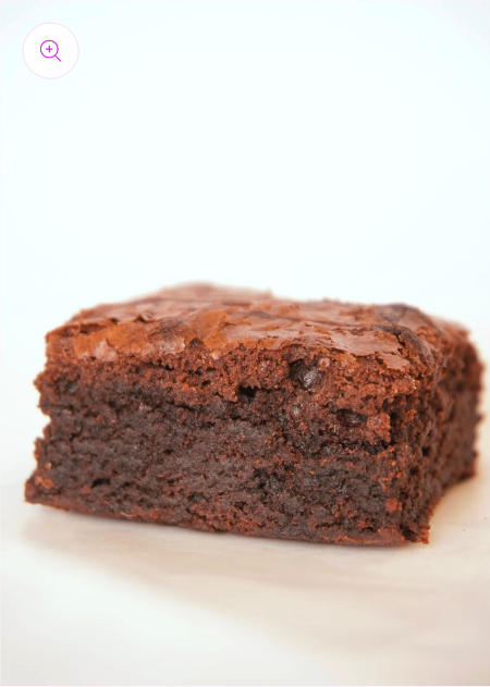 Close-up of Thick Fudge Brownie showing its dense, fudgy texture